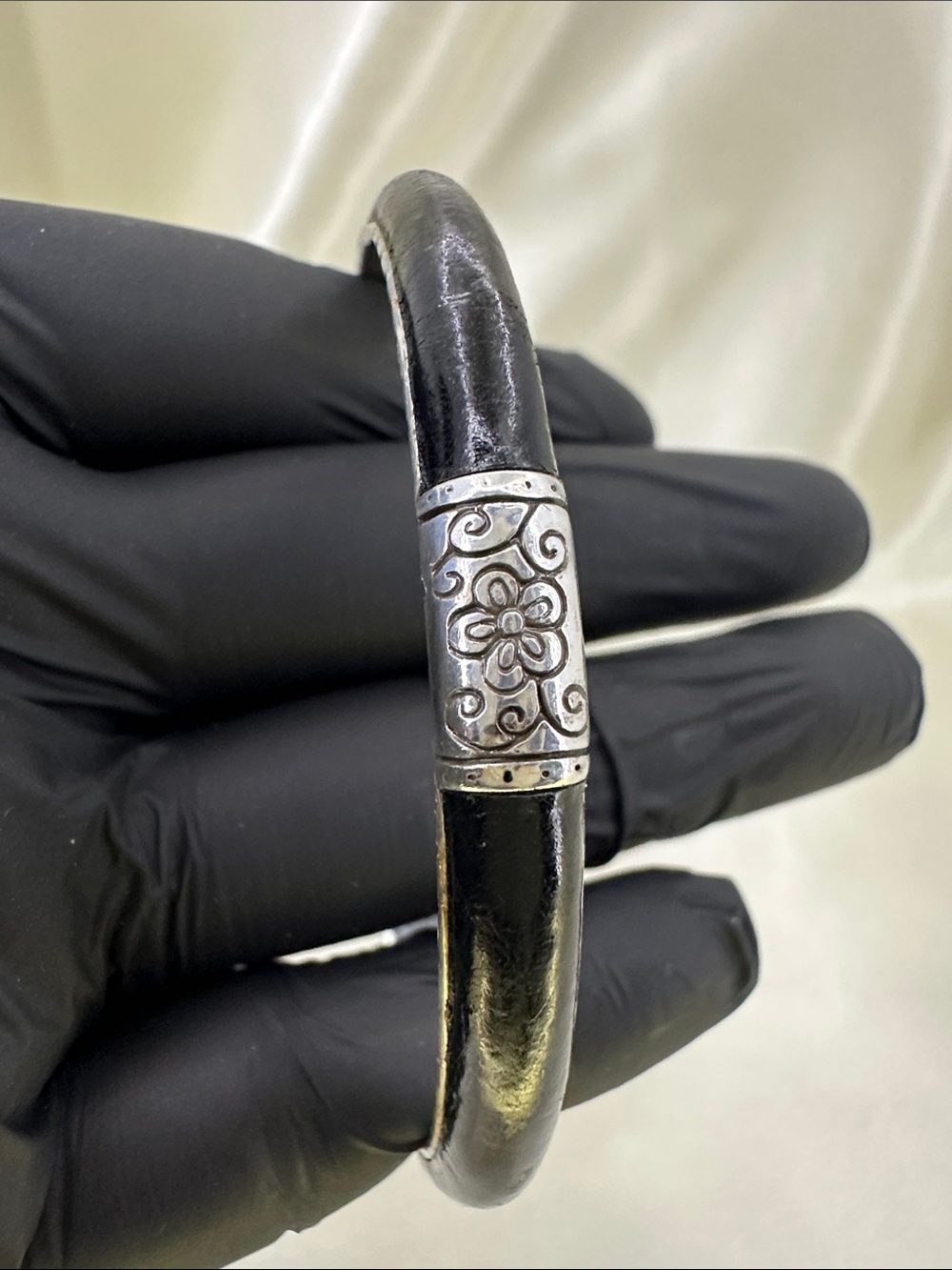 Silver Tone Floral Accent Black Leather Bangle Bracelet